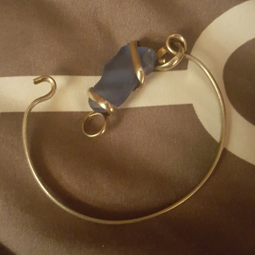 Silver bracelet with blue glass stone